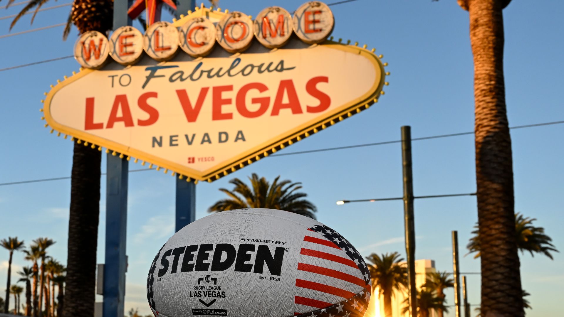 The famous Las Vegas sign with a NRL football in the foreground